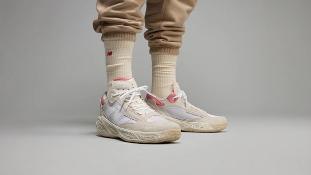Zach LaVine wears tan and pink New Balance basketball shoes.